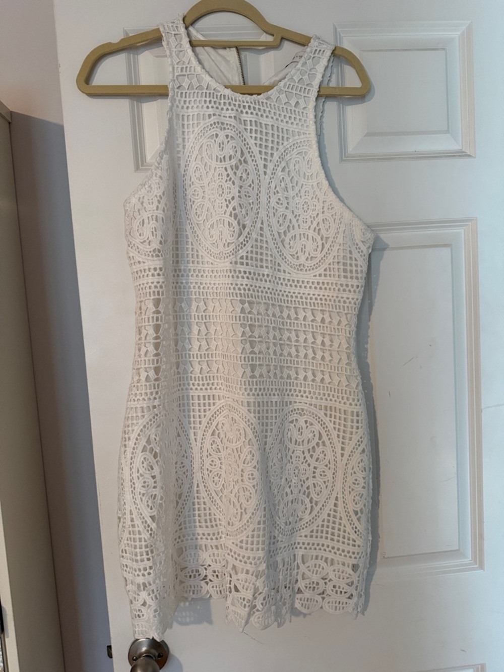 While laced / lined dress . Gold zipper in back.